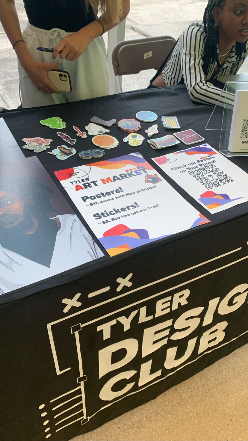 The club booth at the Tyler Art Market, stickers and price list on the table